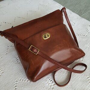 Leather Purse. It's Brown, but has a hint of perhaps "ginger" color in it.